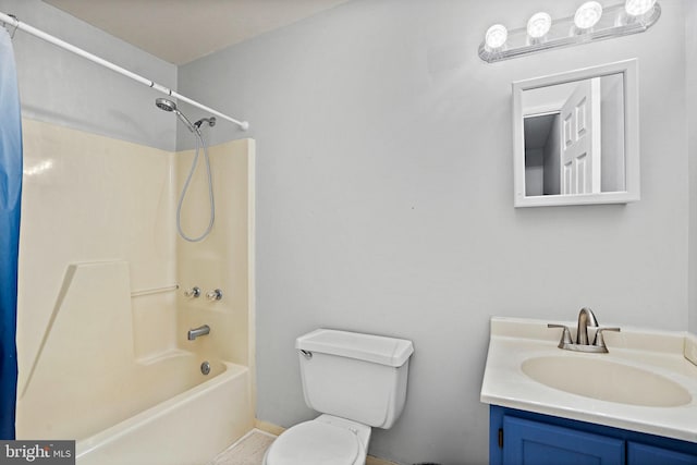 full bathroom with vanity, shower / bath combo with shower curtain, and toilet