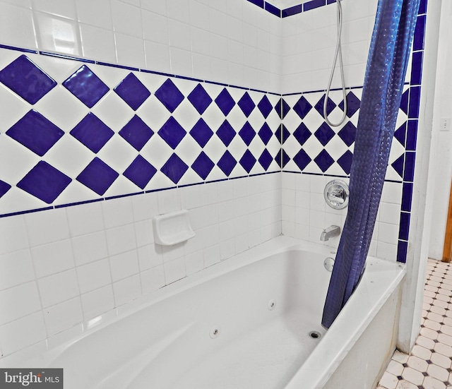 bathroom featuring shower / bath combo and tile patterned floors