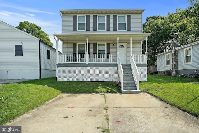 view of front of property with a front yard and covered porch