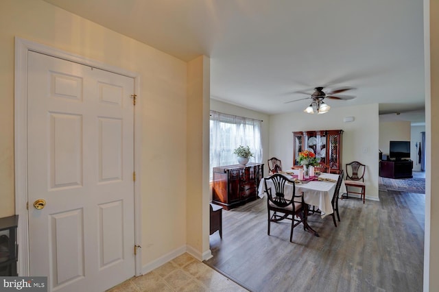 dining area featuring ceiling fan and hardwood / wood-style flooring