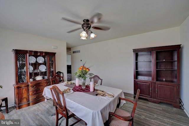 dining room featuring ceiling fan and hardwood / wood-style flooring