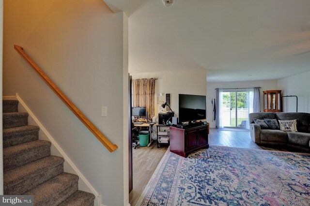13 Kennison Ln, Dover, DE 19901 - living area featuring stairway, baseboards, and wood finished floors