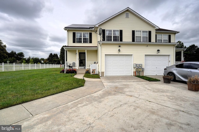 view of property with a front yard, a garage, and a porch