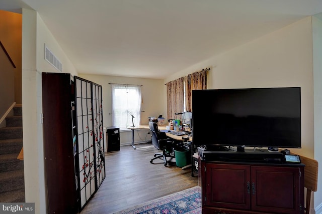 office with light hardwood / wood-style flooring