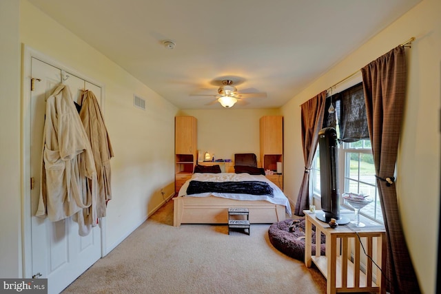 bedroom with ceiling fan and carpet floors