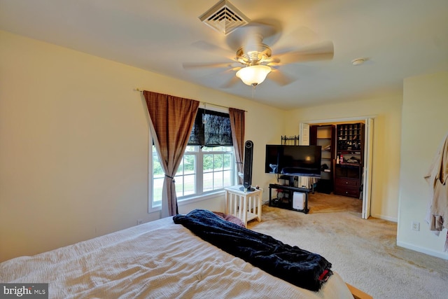 bedroom featuring ceiling fan and light colored carpet