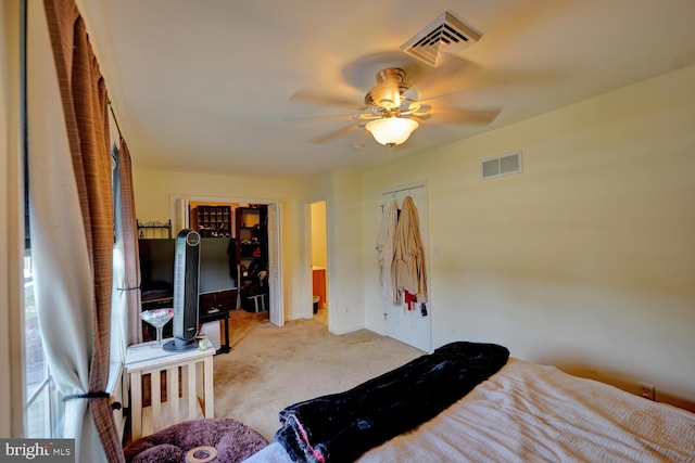 bedroom featuring ceiling fan and light colored carpet