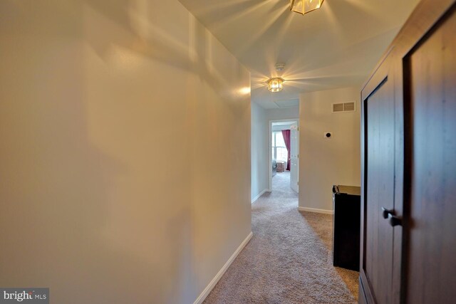 13 Kennison Ln, Dover, DE 19901 - hallway featuring baseboards, carpet, and visible vents