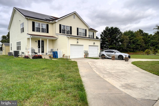 front facade featuring cooling unit, a garage, a porch, and a front lawn