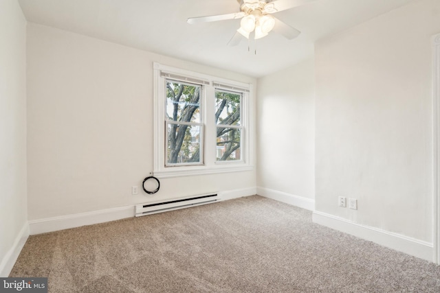 carpeted spare room featuring baseboard heating and ceiling fan