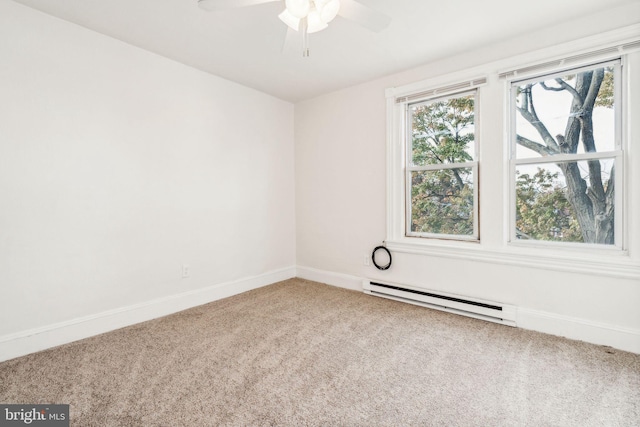 spare room with carpet floors, baseboard heating, and ceiling fan