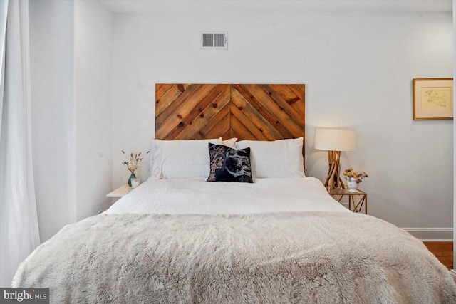 bedroom featuring wood-type flooring