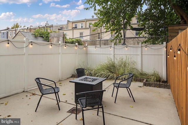 view of patio with a fire pit