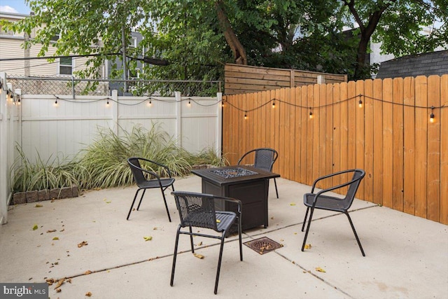 view of patio featuring an outdoor fire pit