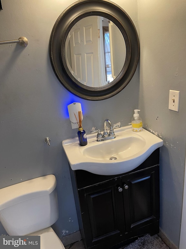 bathroom with vanity and toilet