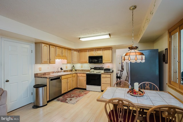 kitchen with pendant lighting, electric stove, light hardwood / wood-style flooring, light brown cabinets, and stainless steel dishwasher