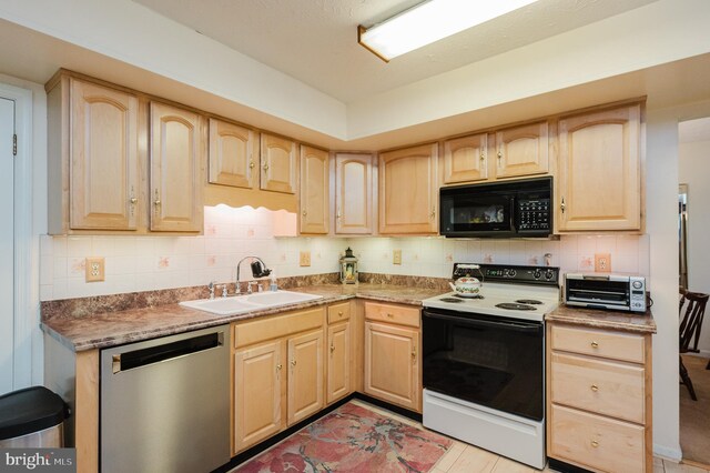 kitchen featuring backsplash, light brown cabinetry, stainless steel dishwasher, sink, and electric range