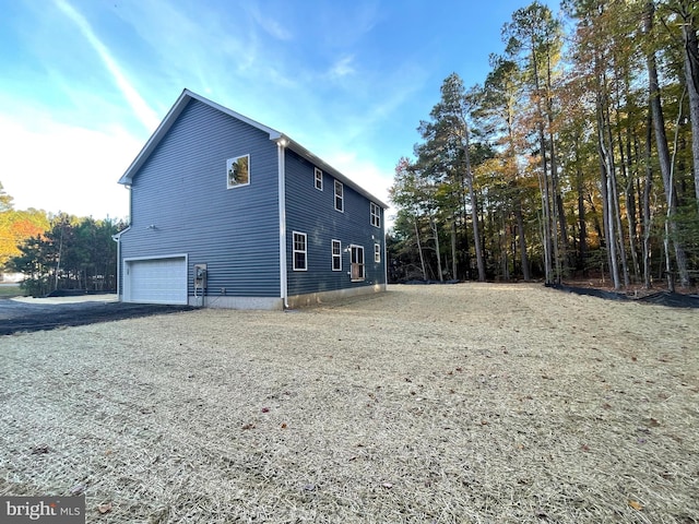 view of home's exterior with a garage