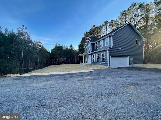 view of side of property with a garage