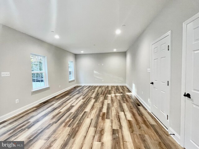 empty room with wood-type flooring