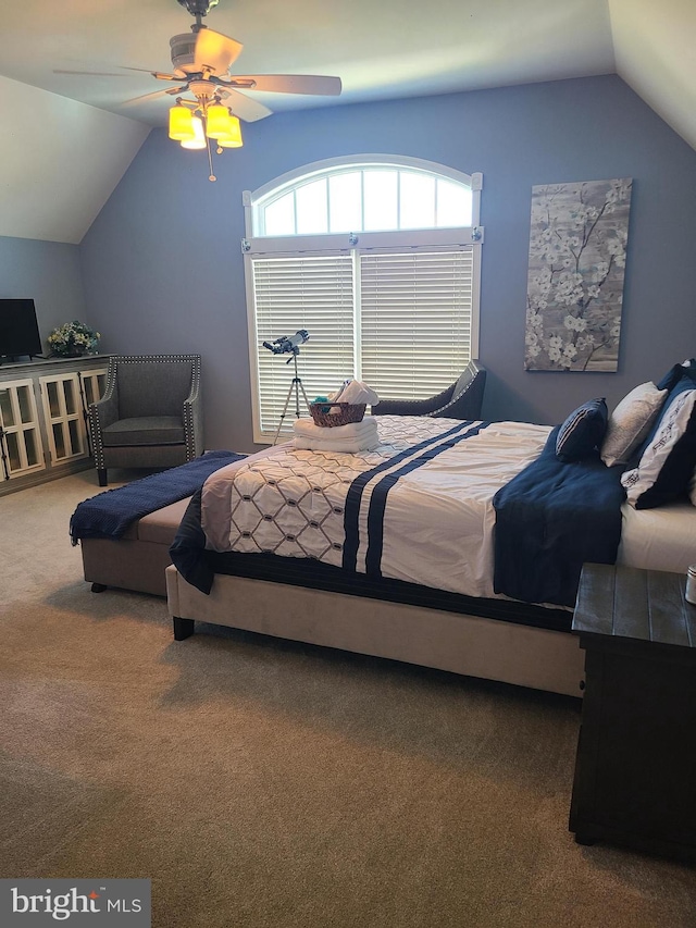 carpeted bedroom featuring lofted ceiling and ceiling fan