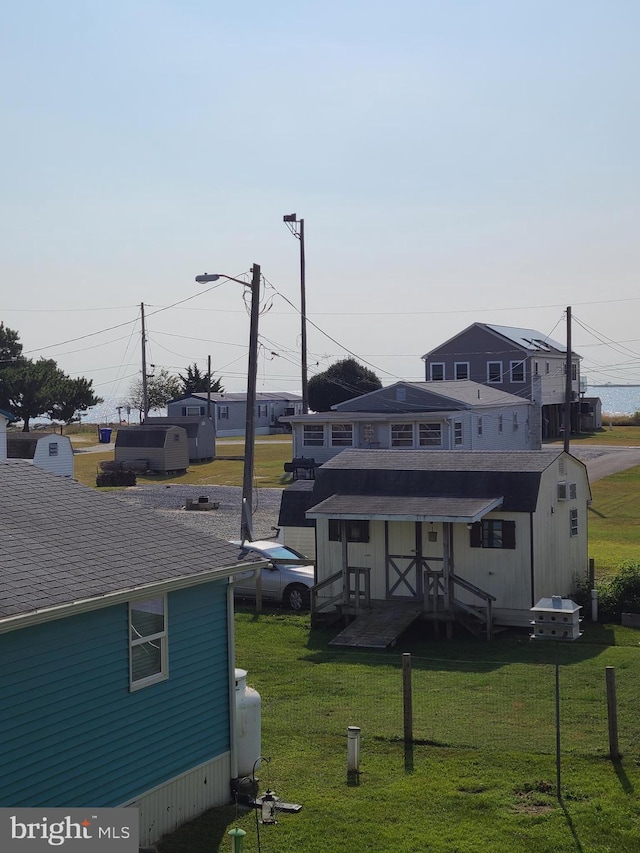 rear view of property with a yard