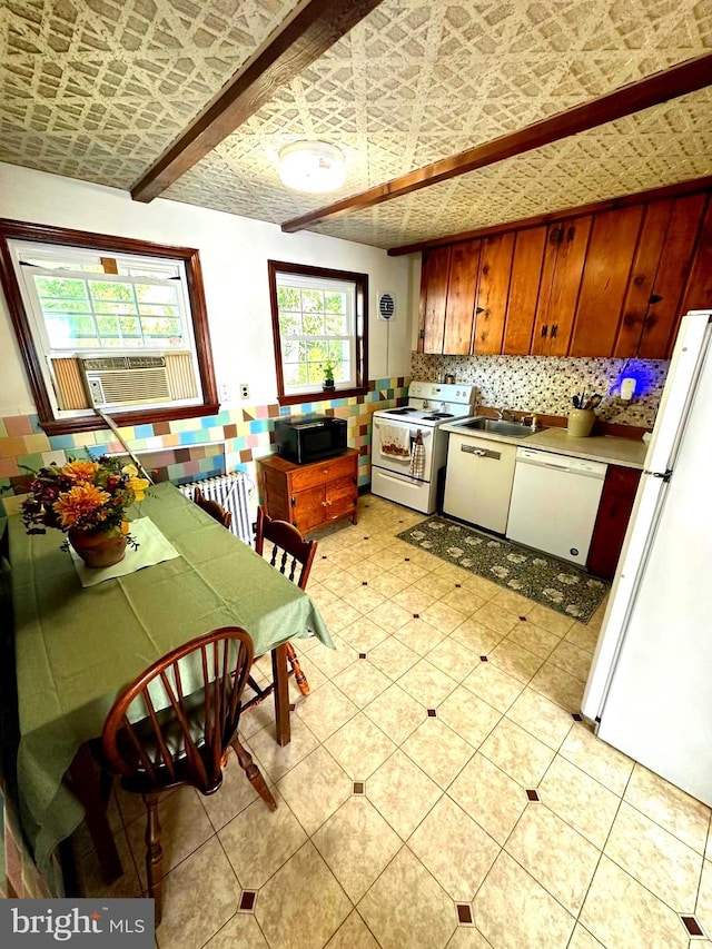 kitchen with decorative backsplash, cooling unit, beamed ceiling, sink, and white appliances