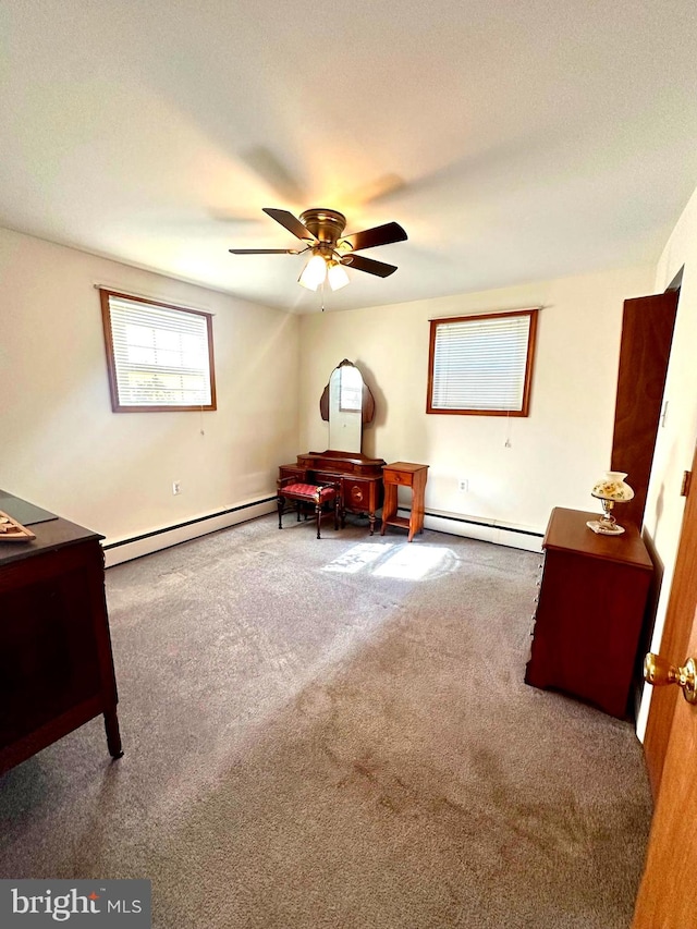 living area featuring ceiling fan, carpet, and a baseboard radiator