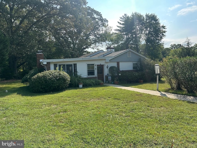 ranch-style house with a front lawn