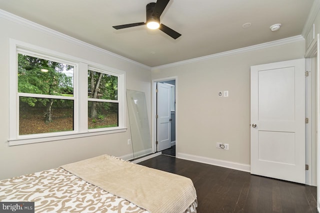 bedroom featuring ornamental molding, ceiling fan, and dark hardwood / wood-style flooring