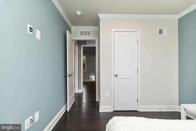 bedroom featuring dark hardwood / wood-style floors and crown molding