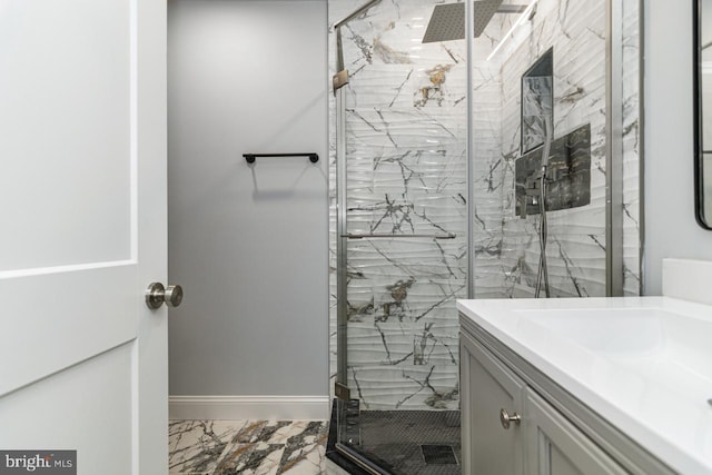 bathroom featuring vanity and a shower with door