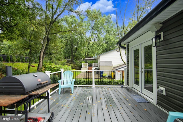 wooden deck with area for grilling