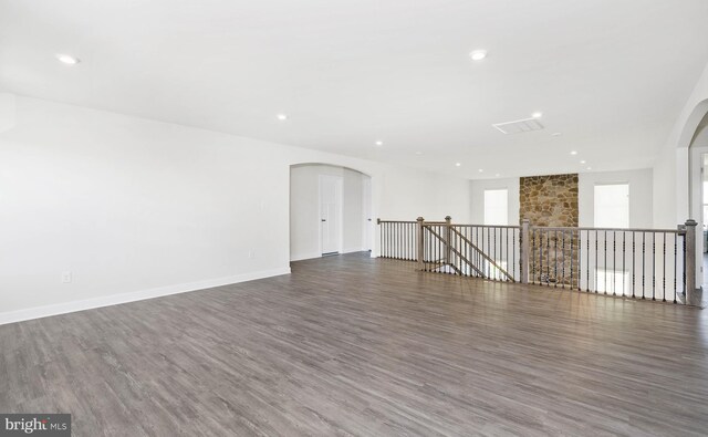 spare room with dark wood-type flooring