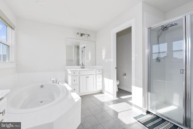 full bathroom with tile patterned floors, vanity, toilet, and shower with separate bathtub