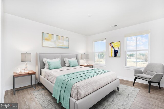 bedroom with hardwood / wood-style flooring