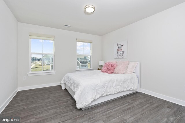 bedroom featuring dark hardwood / wood-style flooring