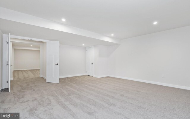 basement with light colored carpet