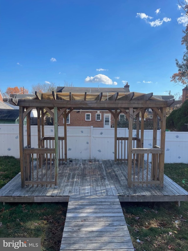 view of dock featuring a pergola and a wooden deck