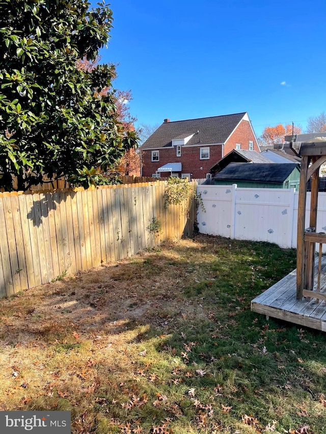 view of yard featuring a wooden deck