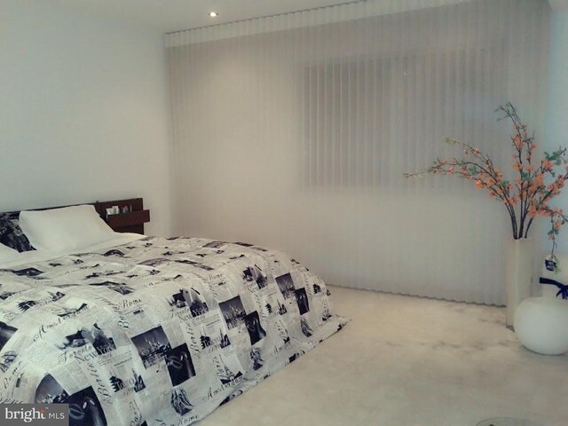 laundry area featuring separate washer and dryer and light tile patterned floors