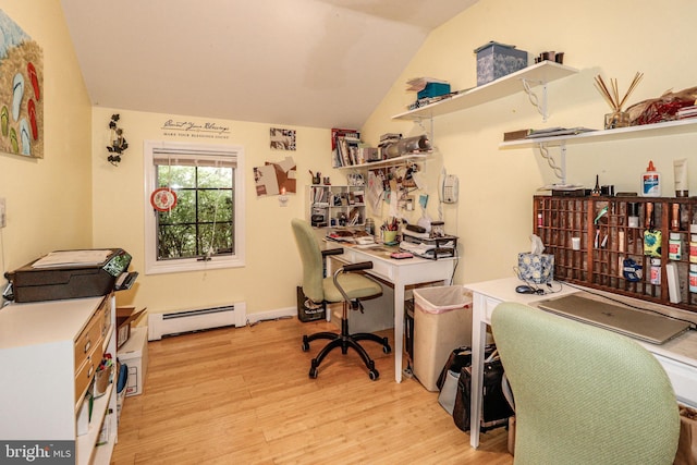 office area featuring lofted ceiling, light hardwood / wood-style floors, and a baseboard heating unit