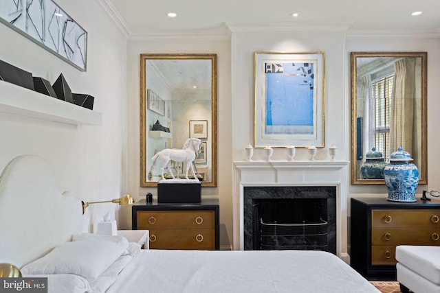 bedroom featuring ornamental molding and a fireplace