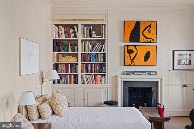 carpeted bedroom featuring ornamental molding