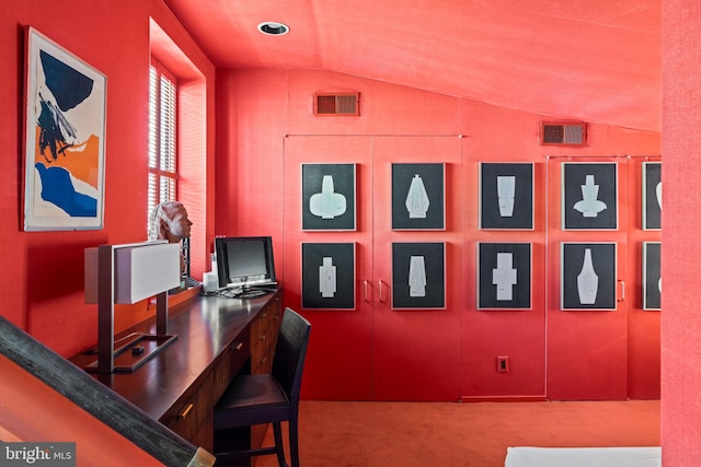 office space featuring lofted ceiling and carpet