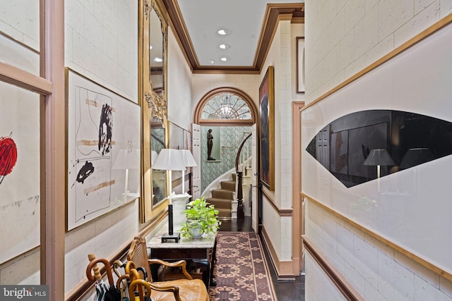 entryway with dark hardwood / wood-style floors and crown molding