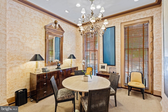 dining room with a notable chandelier, ornamental molding, light carpet, and a wealth of natural light