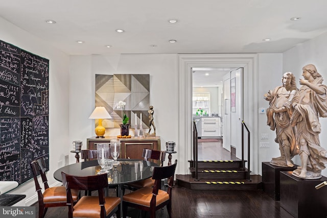 dining space featuring wood-type flooring