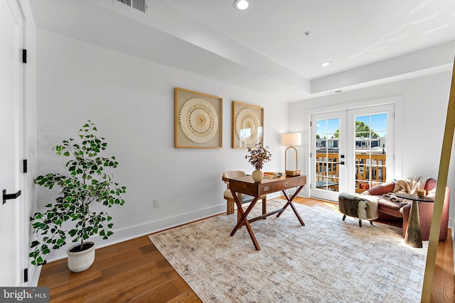 interior space with french doors and wood-type flooring