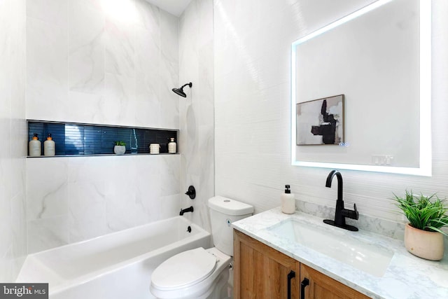 full bathroom with washtub / shower combination, tile walls, vanity, and toilet